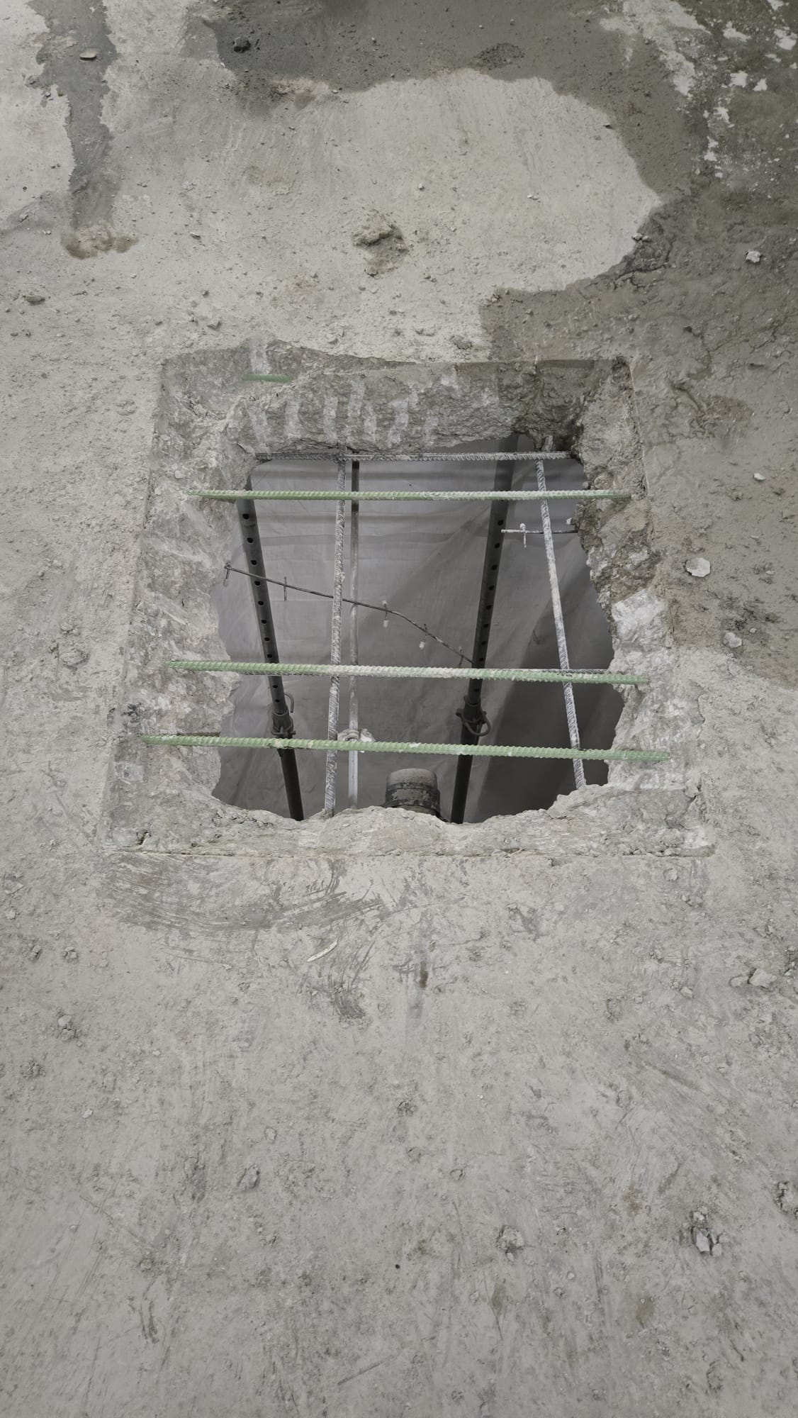 Concrete slab opening with reinforcing steel
